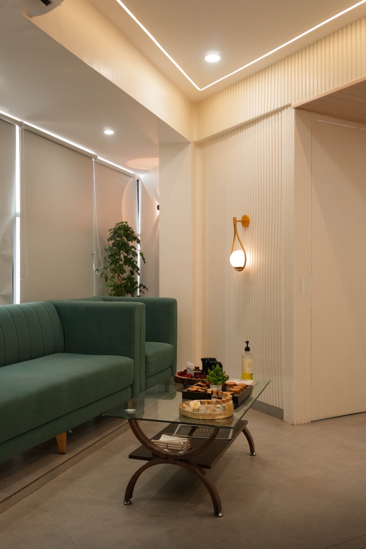 The welcome lounge with green velvet sofas